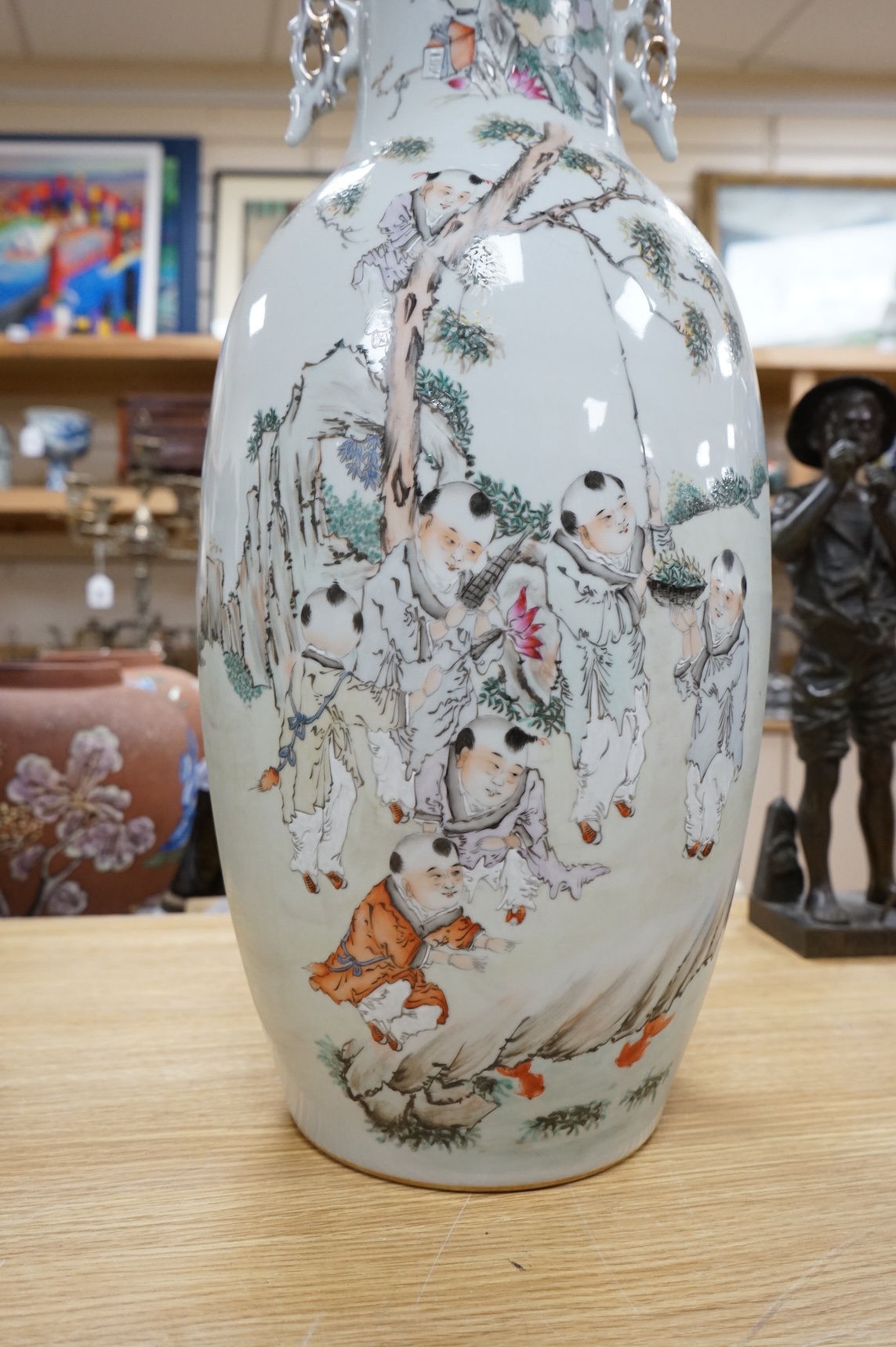 A large Chinese famille rose figural vase, 57cm high